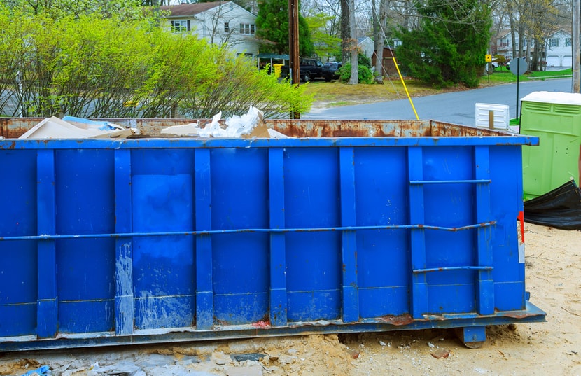 dumpster with construction waste